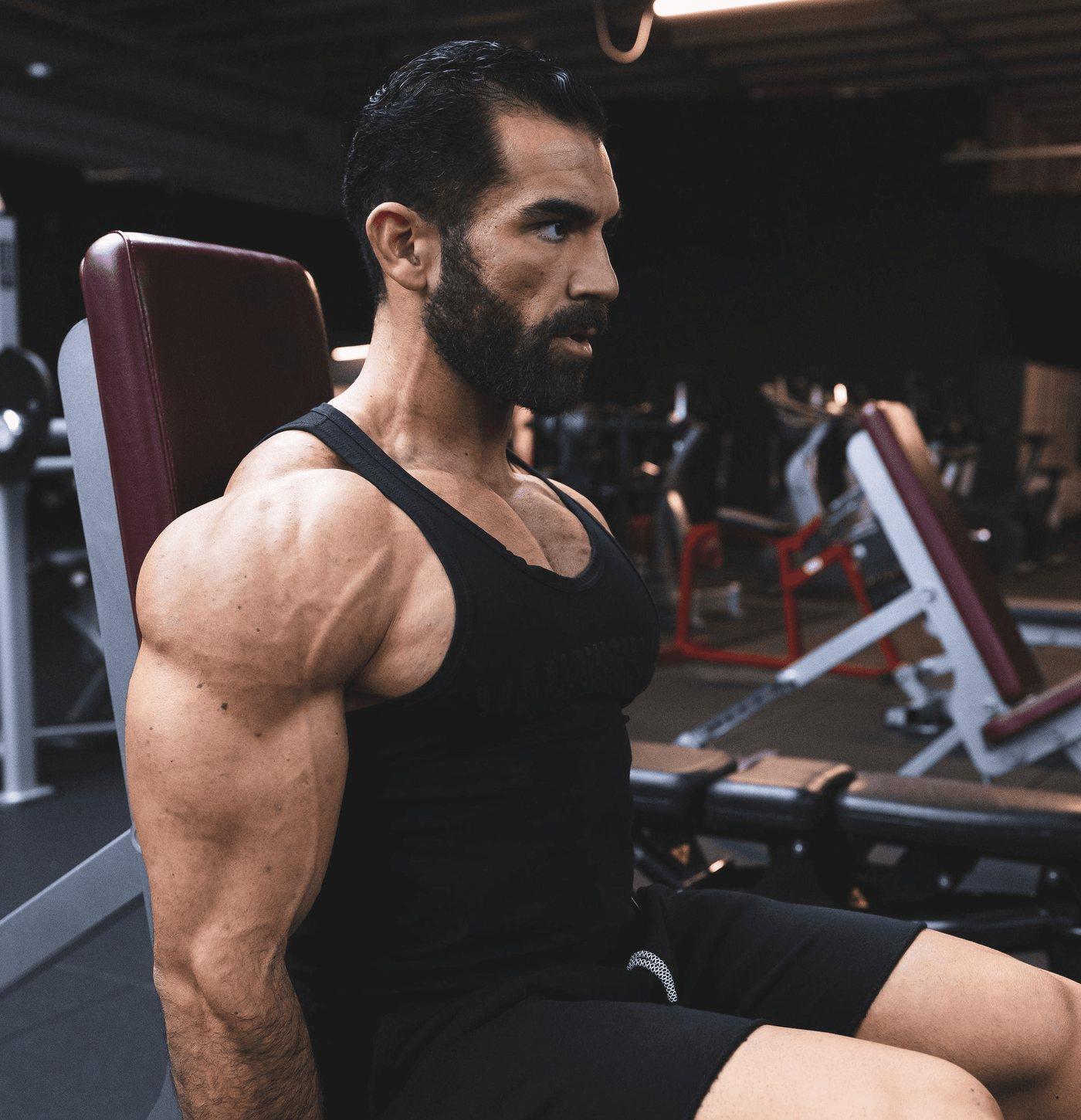 Abdullah Aziz seated between sets, focused